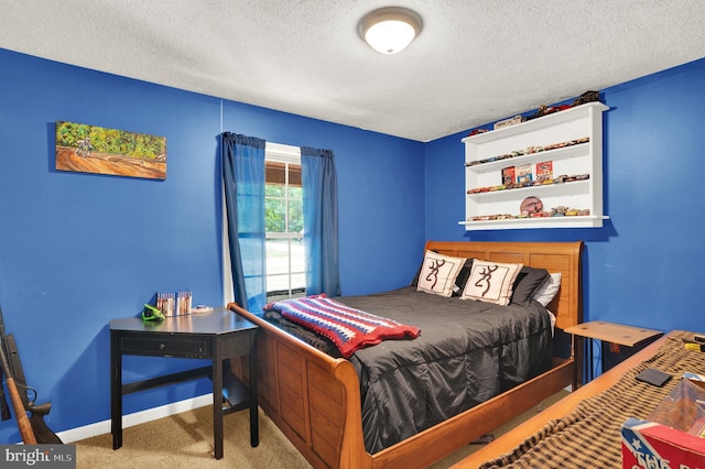 carpeted bedroom featuring a textured ceiling