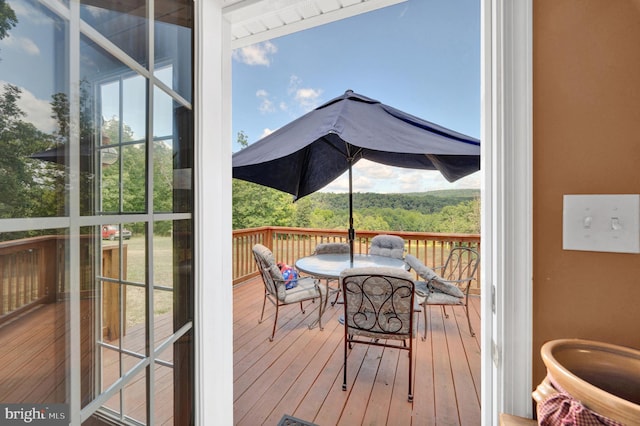 sunroom / solarium featuring a healthy amount of sunlight