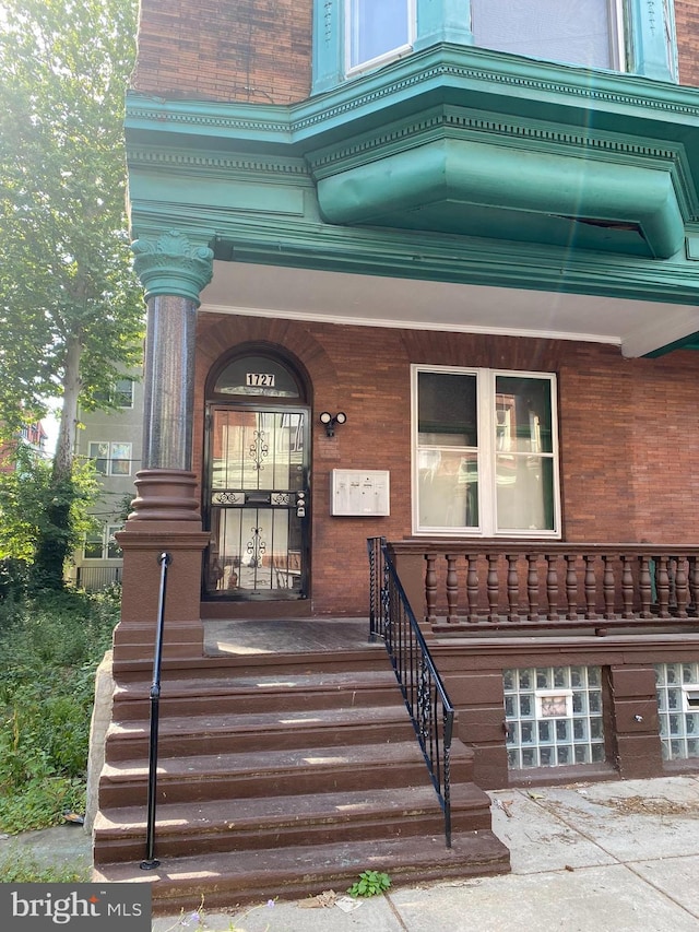 entrance to property with a porch