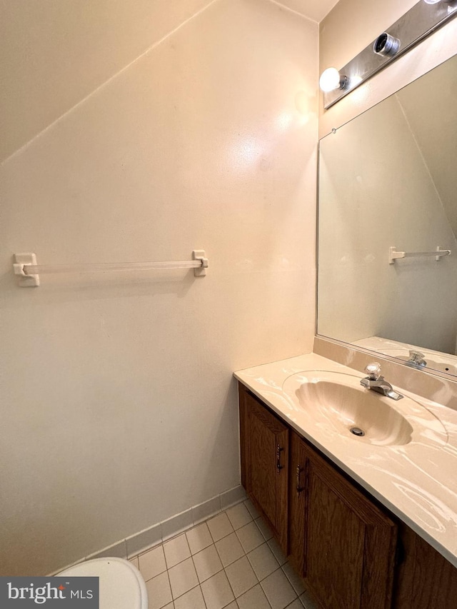 bathroom with tile patterned floors and vanity