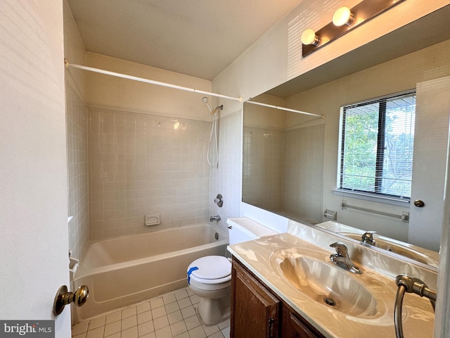 full bathroom featuring tiled shower / bath, tile patterned flooring, vanity, and toilet