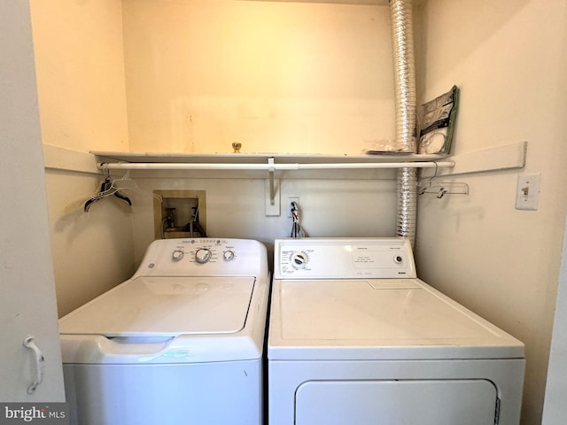 laundry area with washing machine and clothes dryer