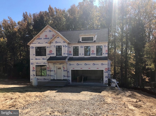 unfinished property with a garage