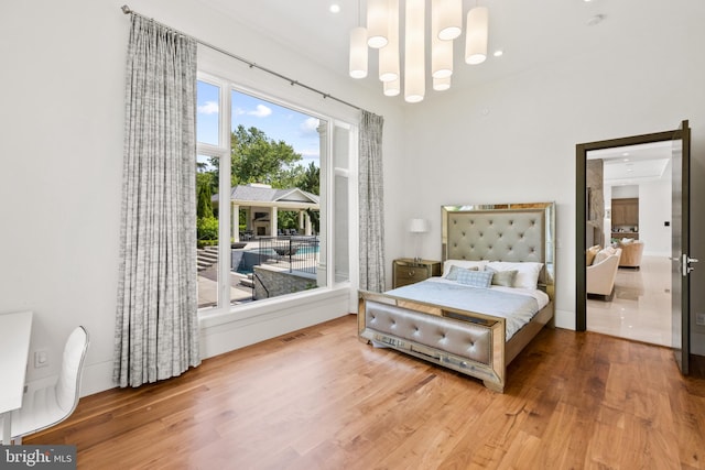 bedroom with hardwood / wood-style floors