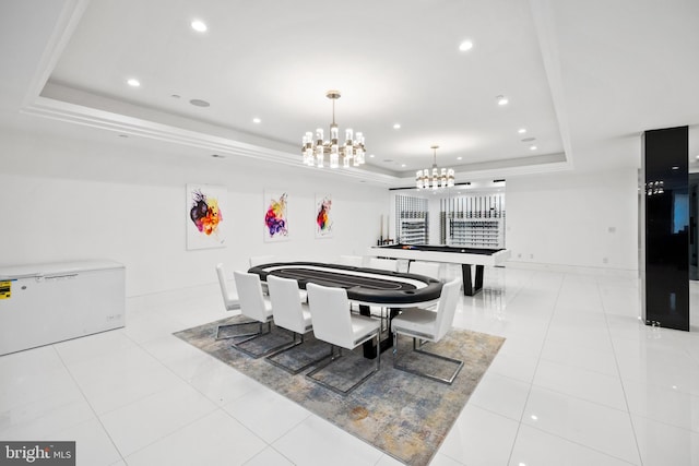 tiled dining area with a raised ceiling and billiards