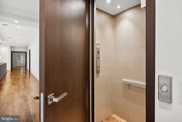 bathroom featuring hardwood / wood-style flooring