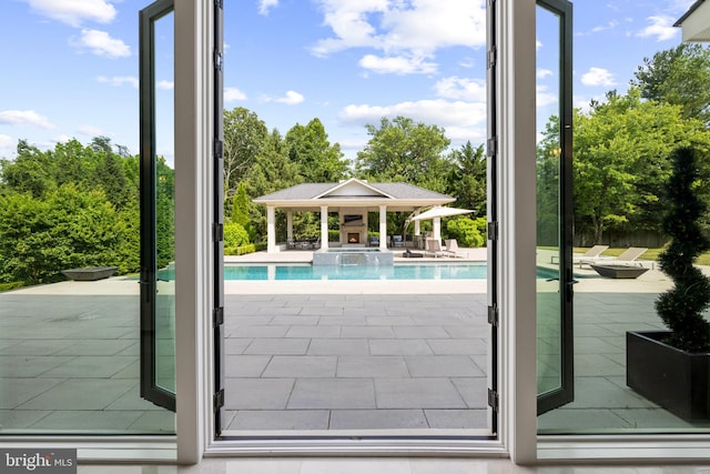 view of pool featuring a gazebo and a patio