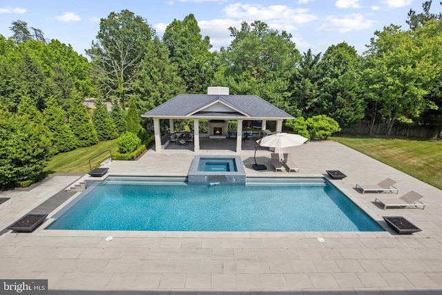 view of pool featuring a gazebo, a patio area, a yard, and an in ground hot tub