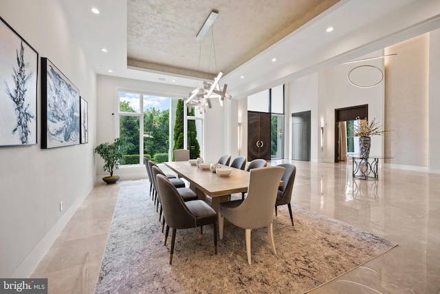 dining room with a notable chandelier