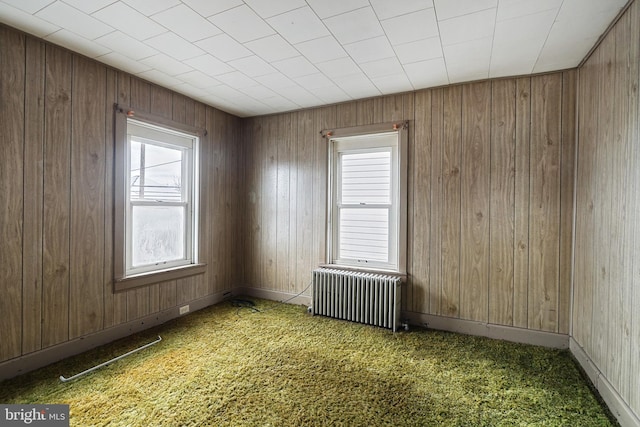 carpeted spare room with radiator