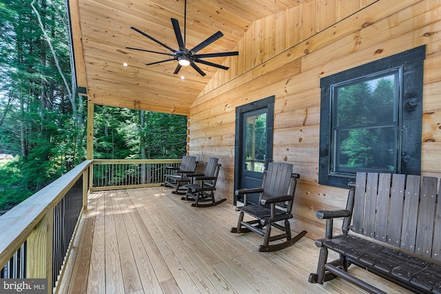 wooden terrace featuring ceiling fan