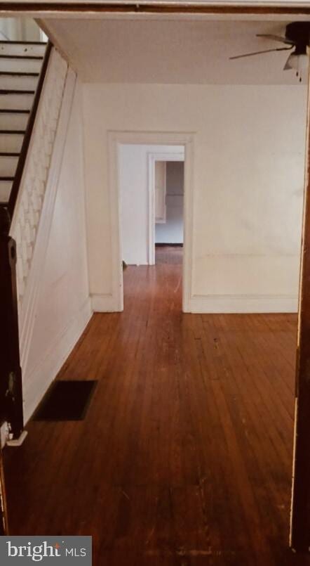 hall with dark hardwood / wood-style floors