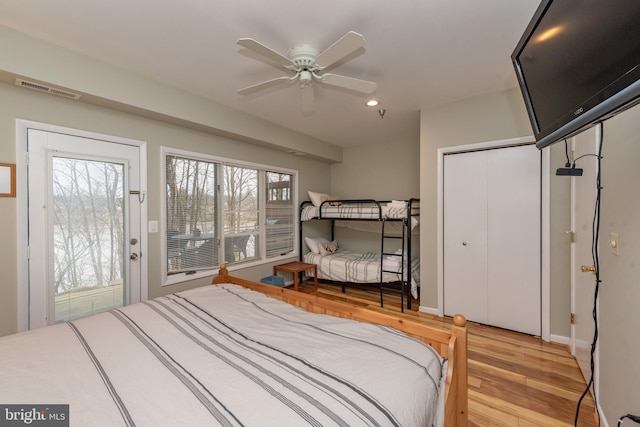 bedroom featuring ceiling fan and light hardwood / wood-style flooring