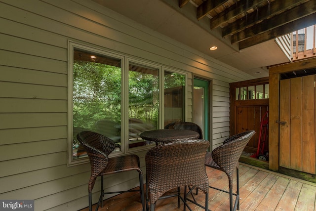 sunroom featuring beamed ceiling