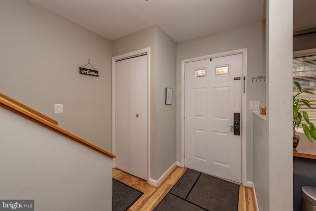 foyer entrance with light hardwood / wood-style floors