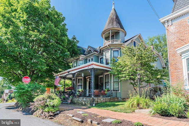 victorian-style house featuring a porch