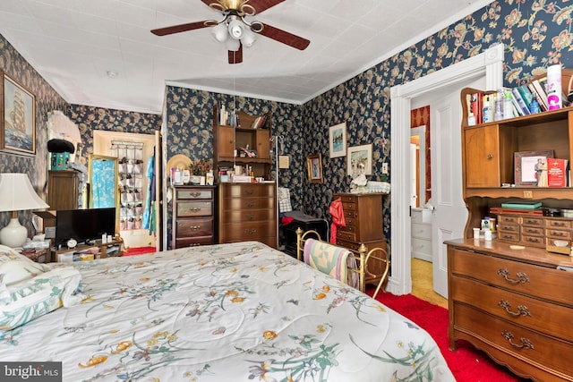 bedroom featuring ceiling fan and crown molding