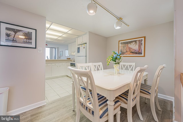 dining room featuring light hardwood / wood-style floors