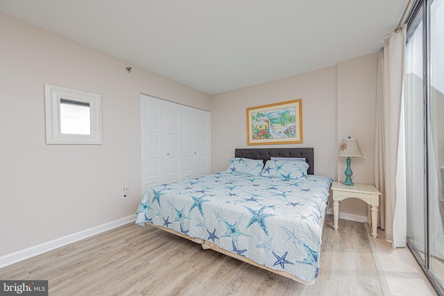 bedroom featuring a closet and hardwood / wood-style flooring