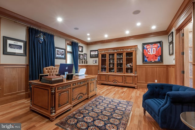 home office featuring light hardwood / wood-style floors and crown molding