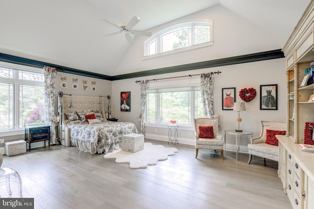 bedroom featuring ceiling fan, high vaulted ceiling, and light hardwood / wood-style flooring