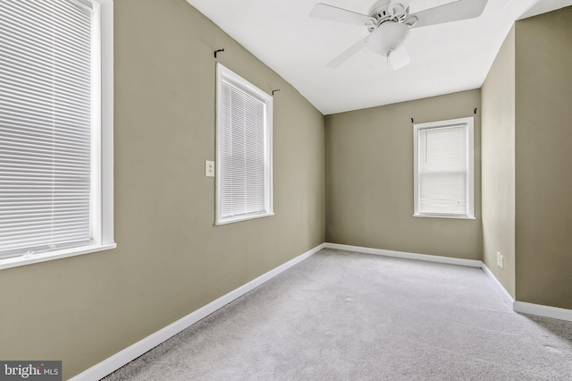 carpeted empty room with ceiling fan