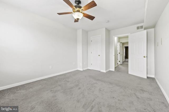 unfurnished bedroom featuring ceiling fan and carpet floors