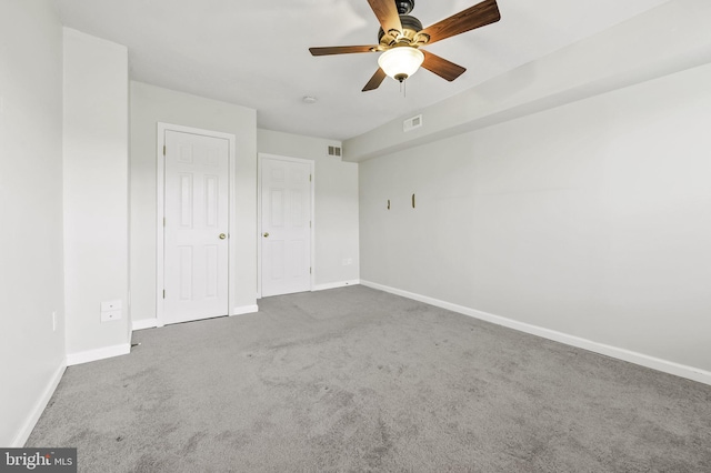 unfurnished bedroom featuring ceiling fan and carpet