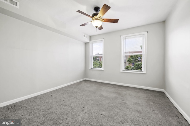 carpeted empty room with ceiling fan