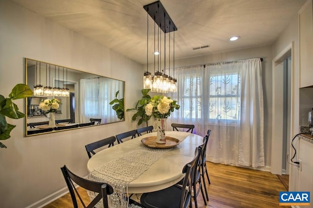 dining area featuring hardwood / wood-style flooring