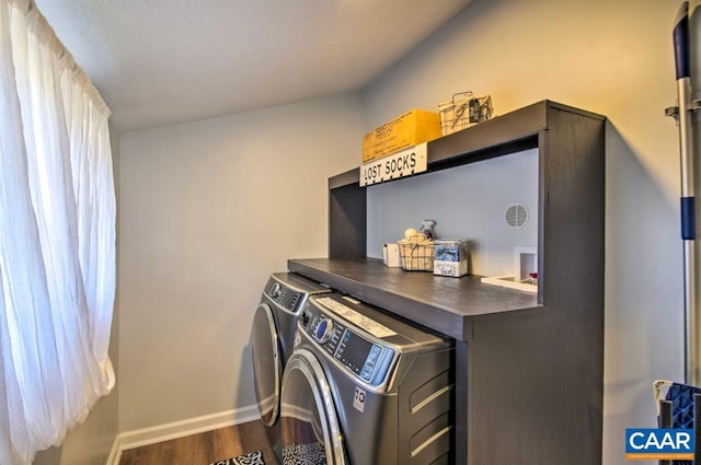 laundry area featuring hardwood / wood-style flooring and washer and dryer