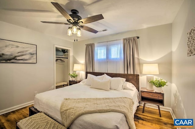 bedroom with ceiling fan, a closet, and hardwood / wood-style flooring