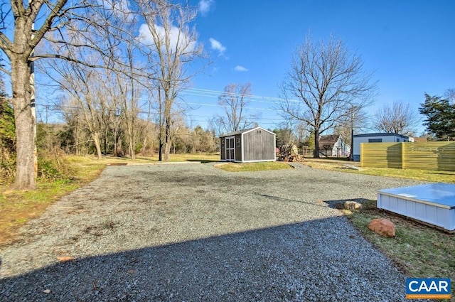 view of yard with a storage shed