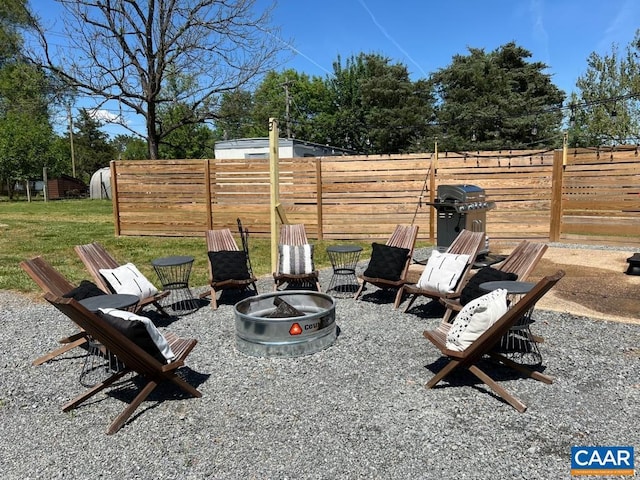 view of yard with a fire pit