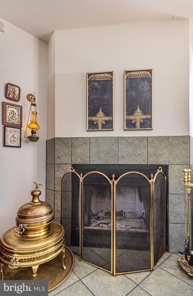 interior details with a tiled fireplace