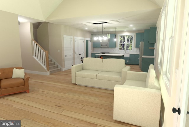 living room with lofted ceiling and light hardwood / wood-style flooring