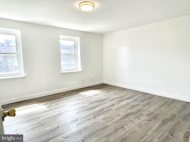 unfurnished room featuring light hardwood / wood-style floors