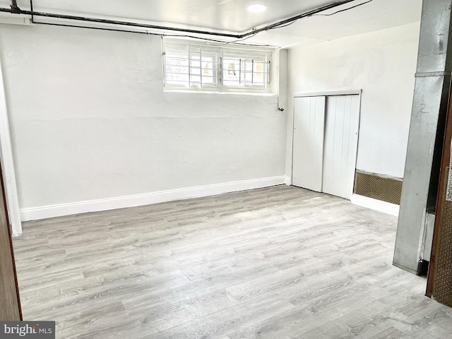 basement with light wood-type flooring