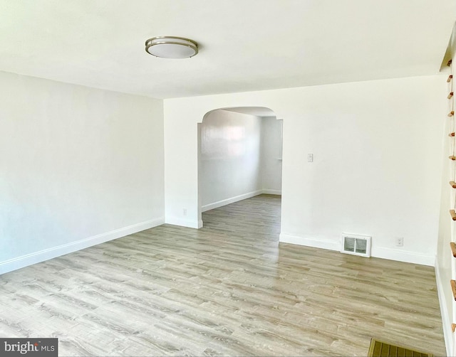 spare room featuring light wood-type flooring