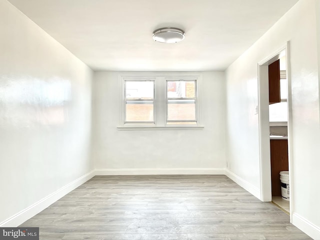 unfurnished room featuring light wood-type flooring