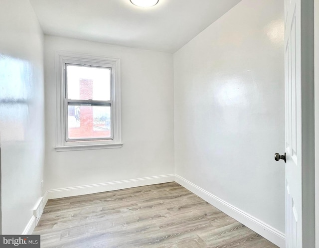 spare room featuring light hardwood / wood-style flooring