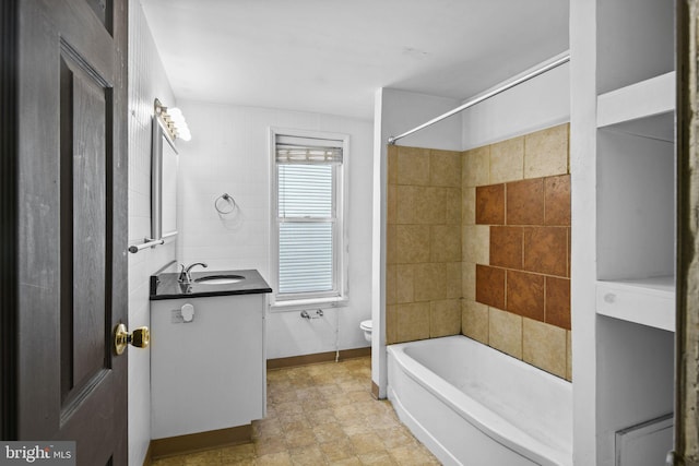 full bathroom with vanity, toilet, and tiled shower / bath