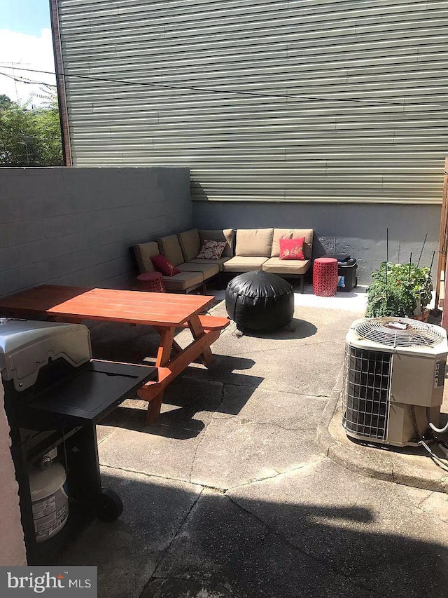 view of patio featuring cooling unit and an outdoor hangout area