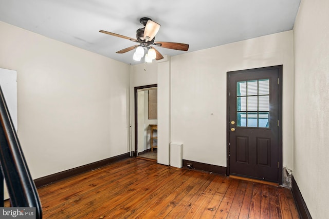 foyer featuring ceiling fan and dark hardwood / wood-style floors