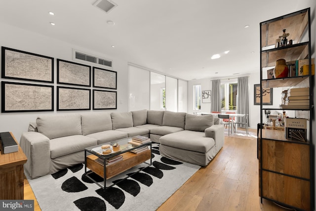 living room with light hardwood / wood-style flooring