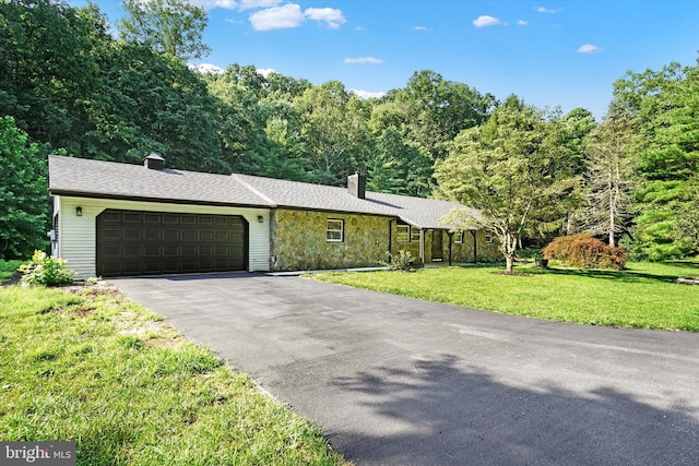 ranch-style house with a front yard and a garage