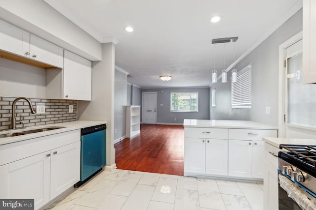 kitchen with decorative backsplash, stainless steel appliances, sink, pendant lighting, and white cabinetry