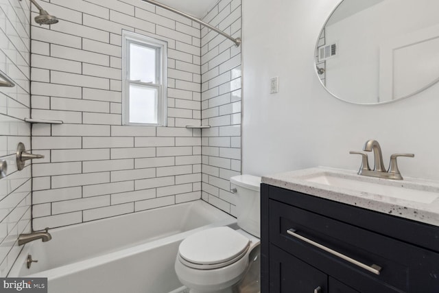 full bathroom with vanity, toilet, and tiled shower / bath combo