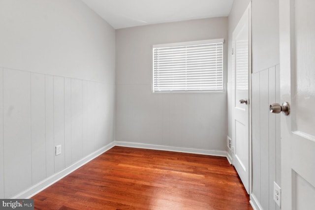 unfurnished bedroom with hardwood / wood-style flooring