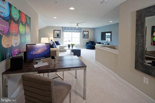 home office with ceiling fan, carpet floors, and vaulted ceiling